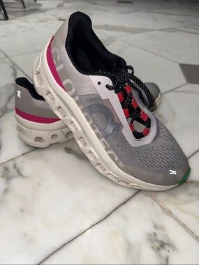 On Running Grey Running Shoes with Black, Pink, and Green Accents